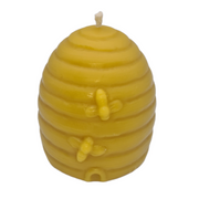 Large beeswax candle moulded as a traditional beehive