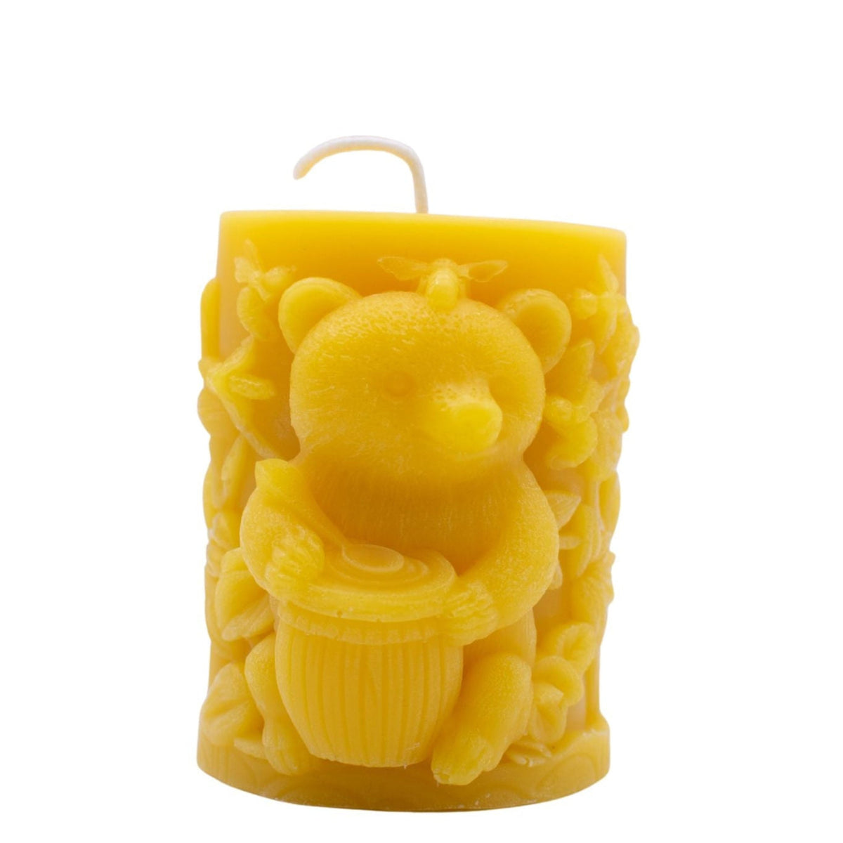 Beeswax candle moulded as a bear with a honey pot