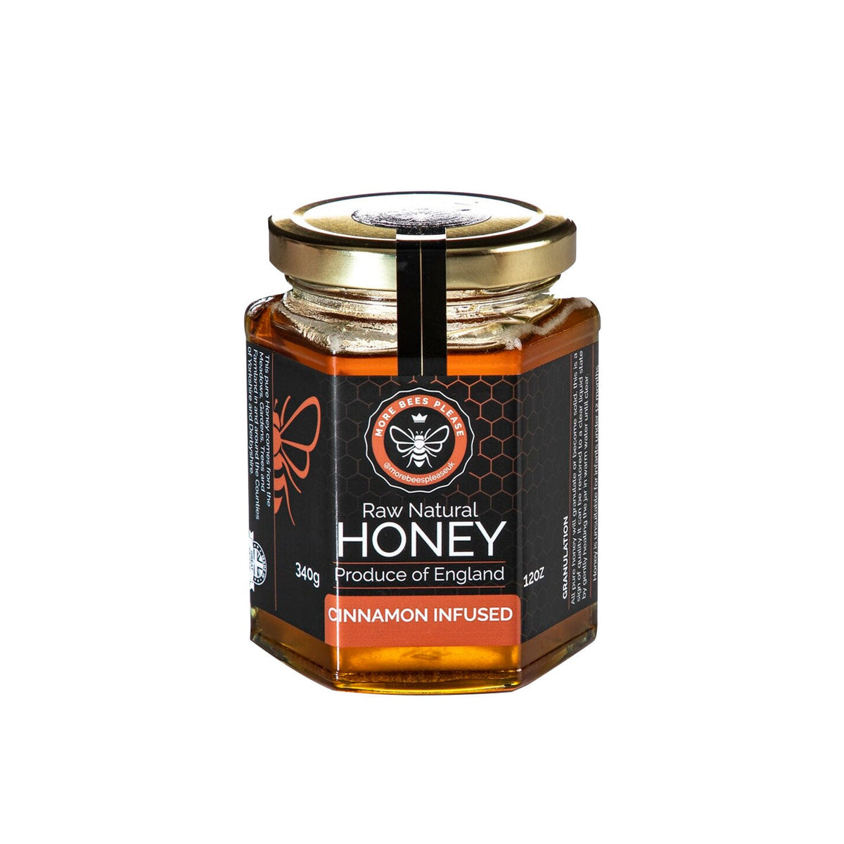 Jar of raw British honey infused with cinnamon