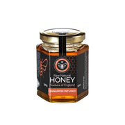 Jar of raw British honey infused with cinnamon